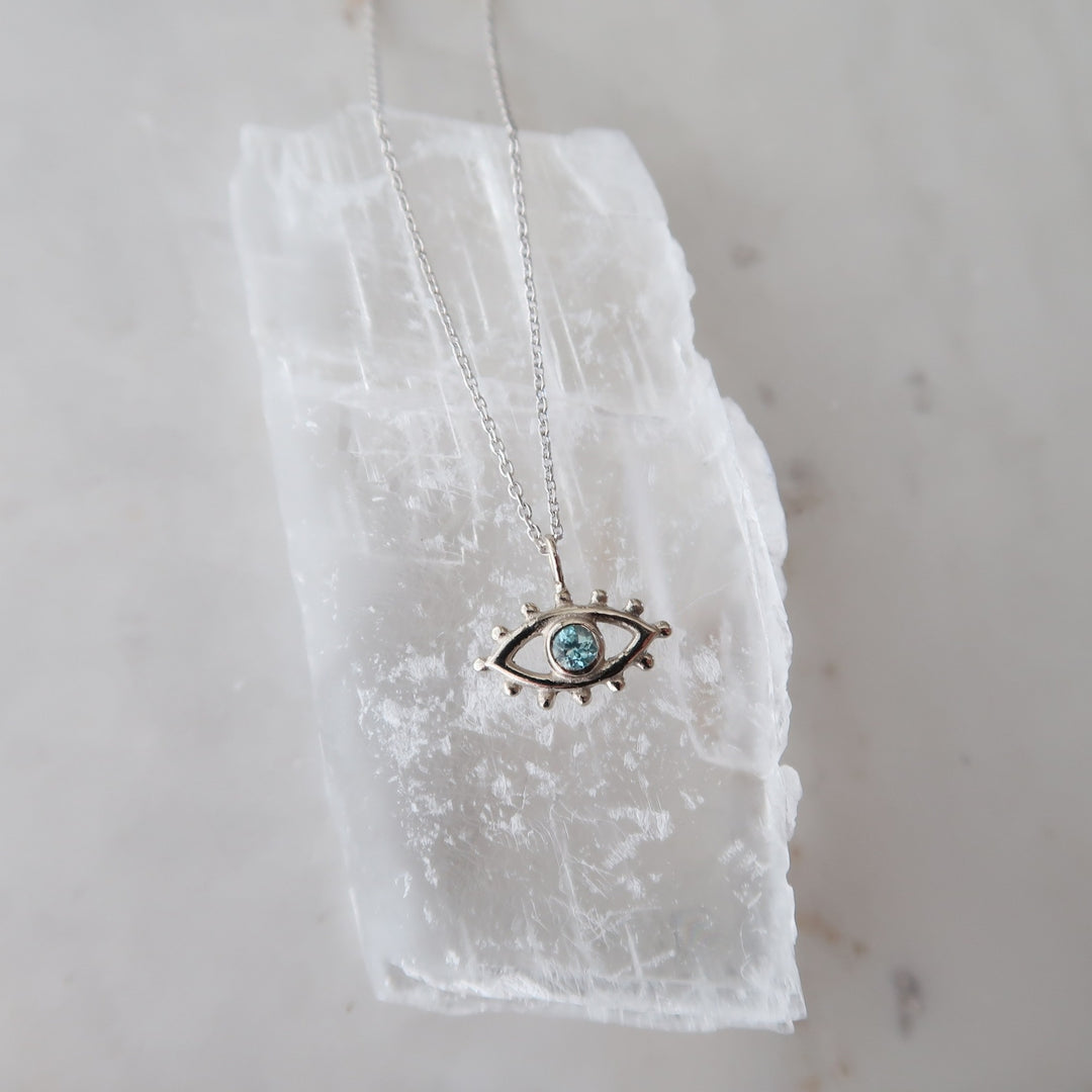 Blue Zircon Beholder Necklace in White Gold