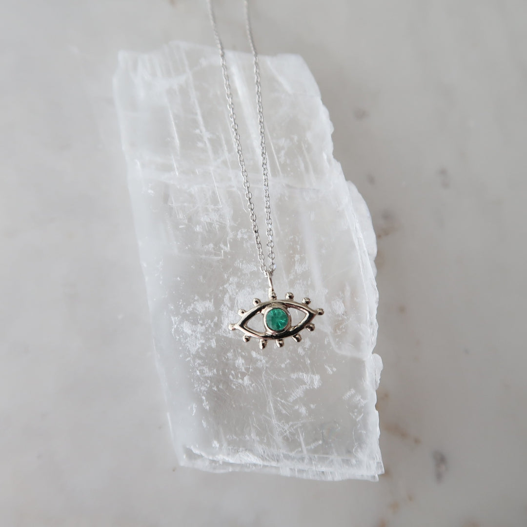 Emerald Beholder Necklace in White Gold