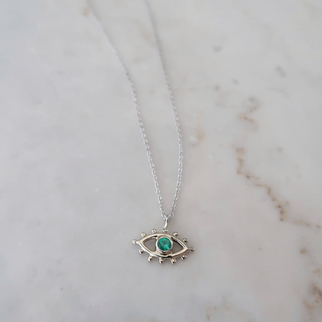 Emerald Beholder Necklace in White Gold