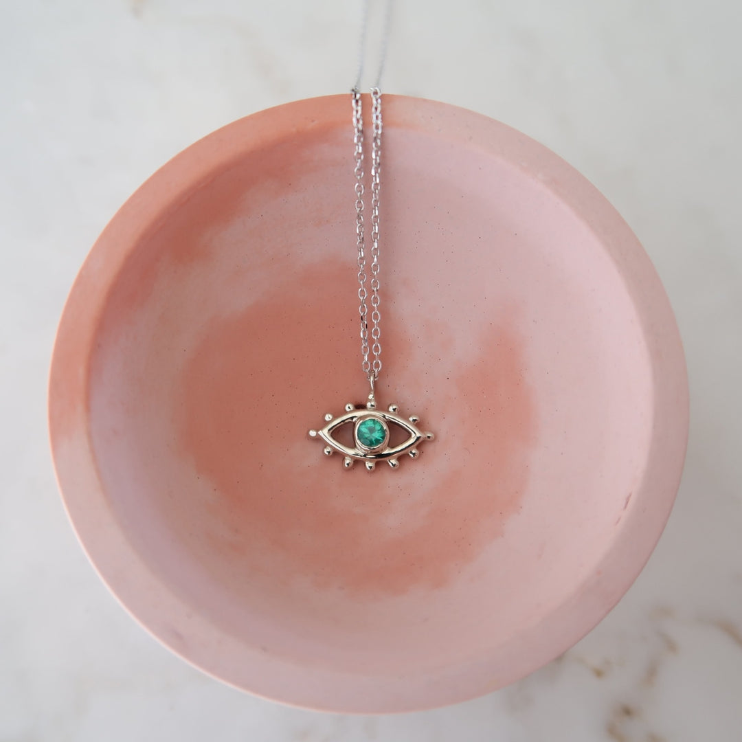 Emerald Beholder Necklace in White Gold