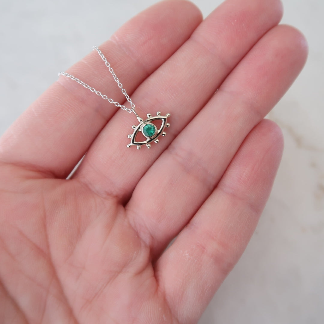 Emerald Beholder Necklace in White Gold